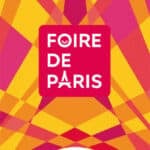 Poster for Foire de Paris with a magenta logo on a yellow-orange geometric background; dates 30 April–10 May 2027 at Paris Expo Porte de Versailles.